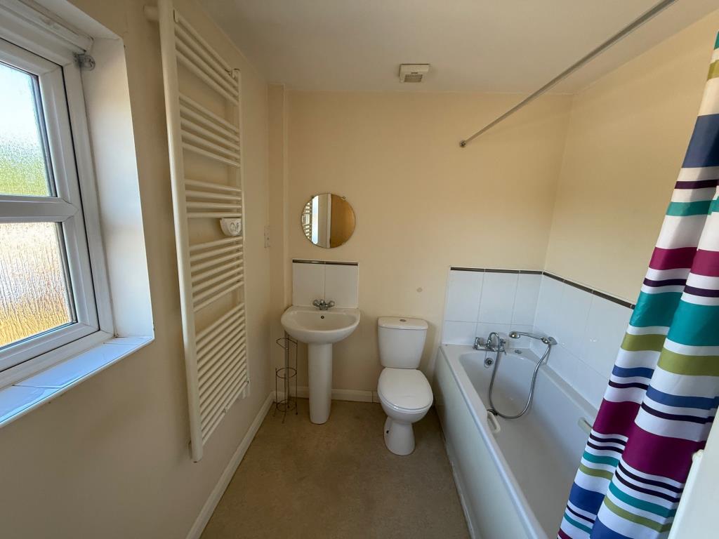 Lot: 136 - VACANT TWO-BEDROOM COACH HOUSE APARTMENT WITH GARAGE - Bathroom with heated towel rail and window to rear